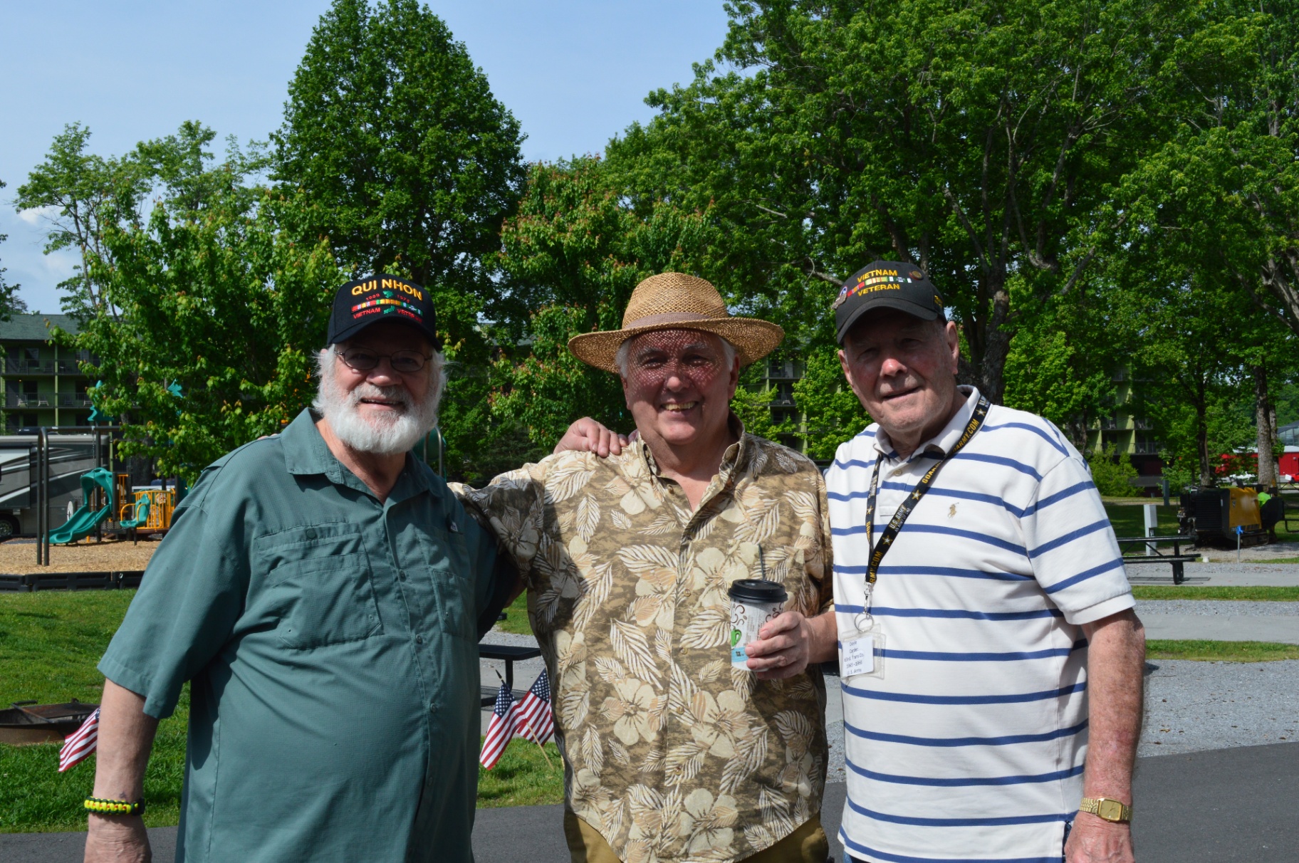 Three Vietnam veterans posing together outdoors